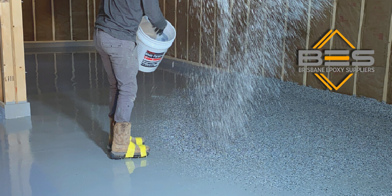 Applying paint flakes to concrete floors